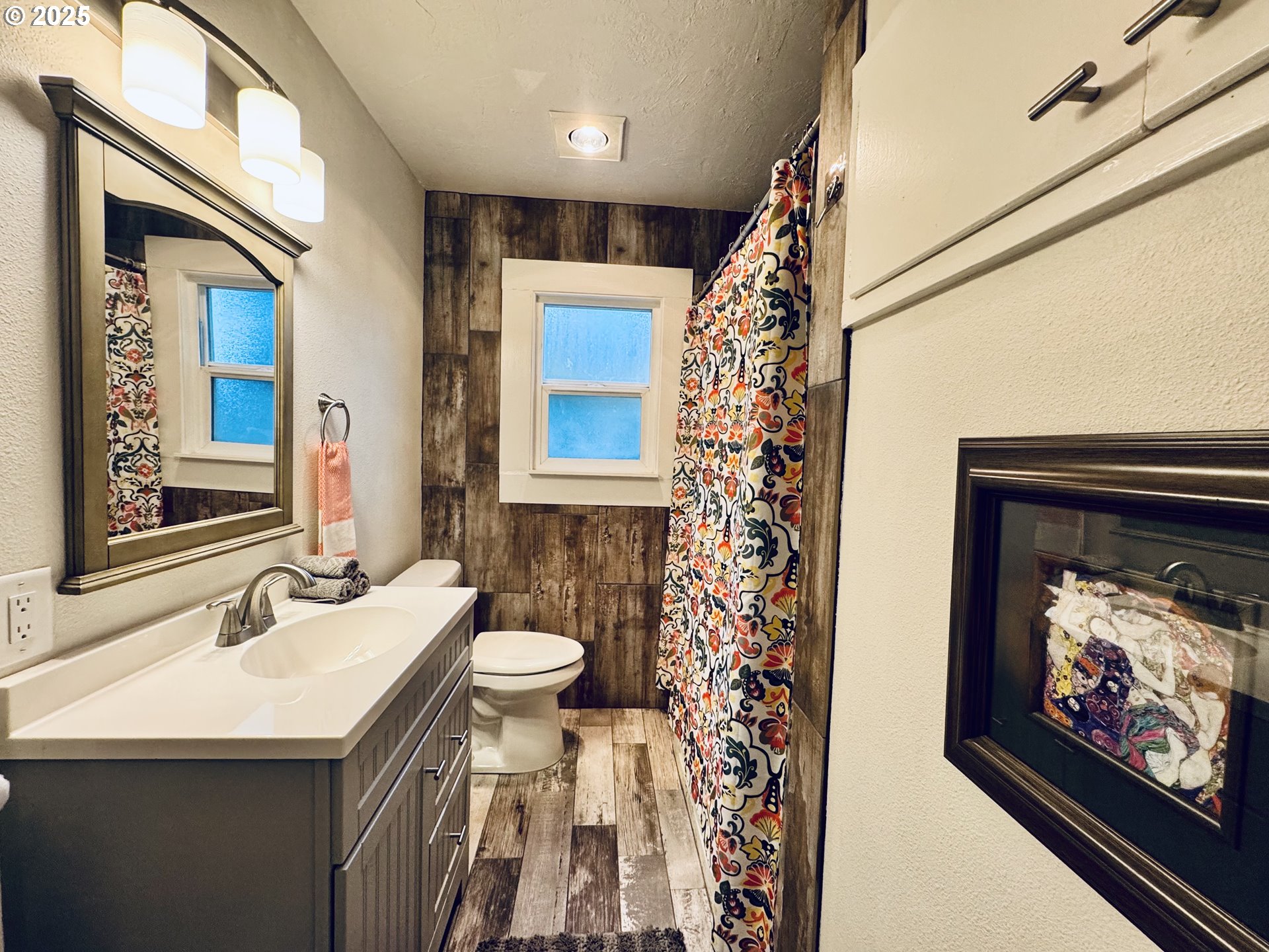 1522 B Street Springfield, OR 97477 - Photo 10 of 22 a bathroom with a sink toilet and shower