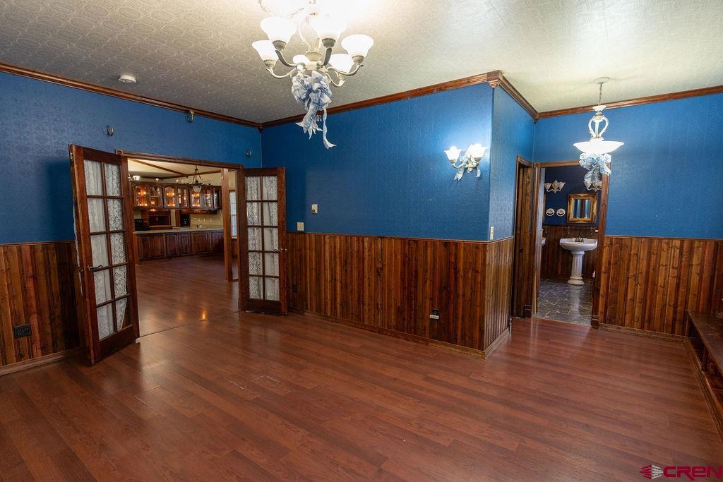19 Pine Cone Circle Bayfield, CO 81122 - Photo 14 of 31 a view of a livingroom with furniture wooden floor and chandelier