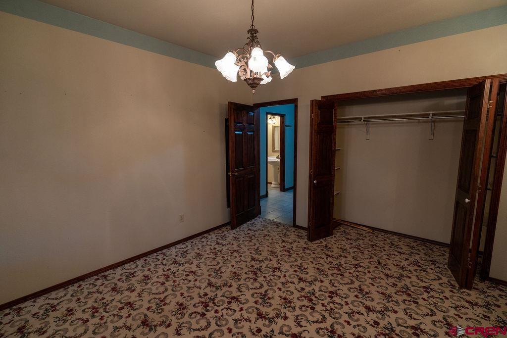 19 Pine Cone Circle Bayfield, CO 81122 - Photo 18 of 31 a view of a room with a large mirror and a shower