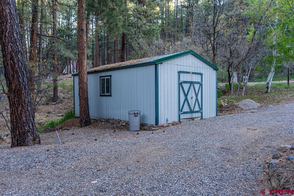 19 Pine Cone Circle Bayfield, CO 81122 - Photo 28 of 31 a view of backyard of house and trees