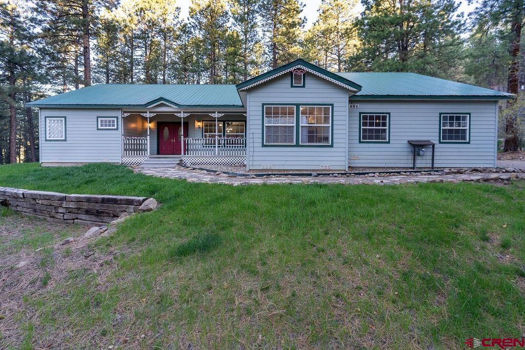 19 Pine Cone Circle Bayfield, CO 81122 - Photo 5 of 31 a front view of a house with a yard