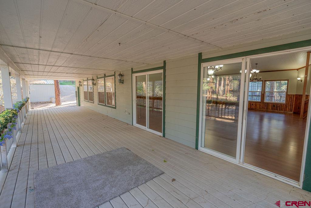 19 Pine Cone Circle Bayfield, CO 81122 - Photo 6 of 31 wooden floor and windows in an empty room