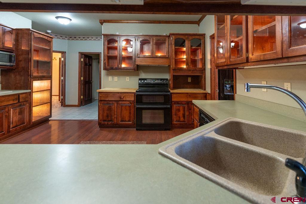 19 Pine Cone Circle Bayfield, CO 81122 - Photo 9 of 31 a kitchen with stainless steel appliances granite countertop a oven and a refrigerator