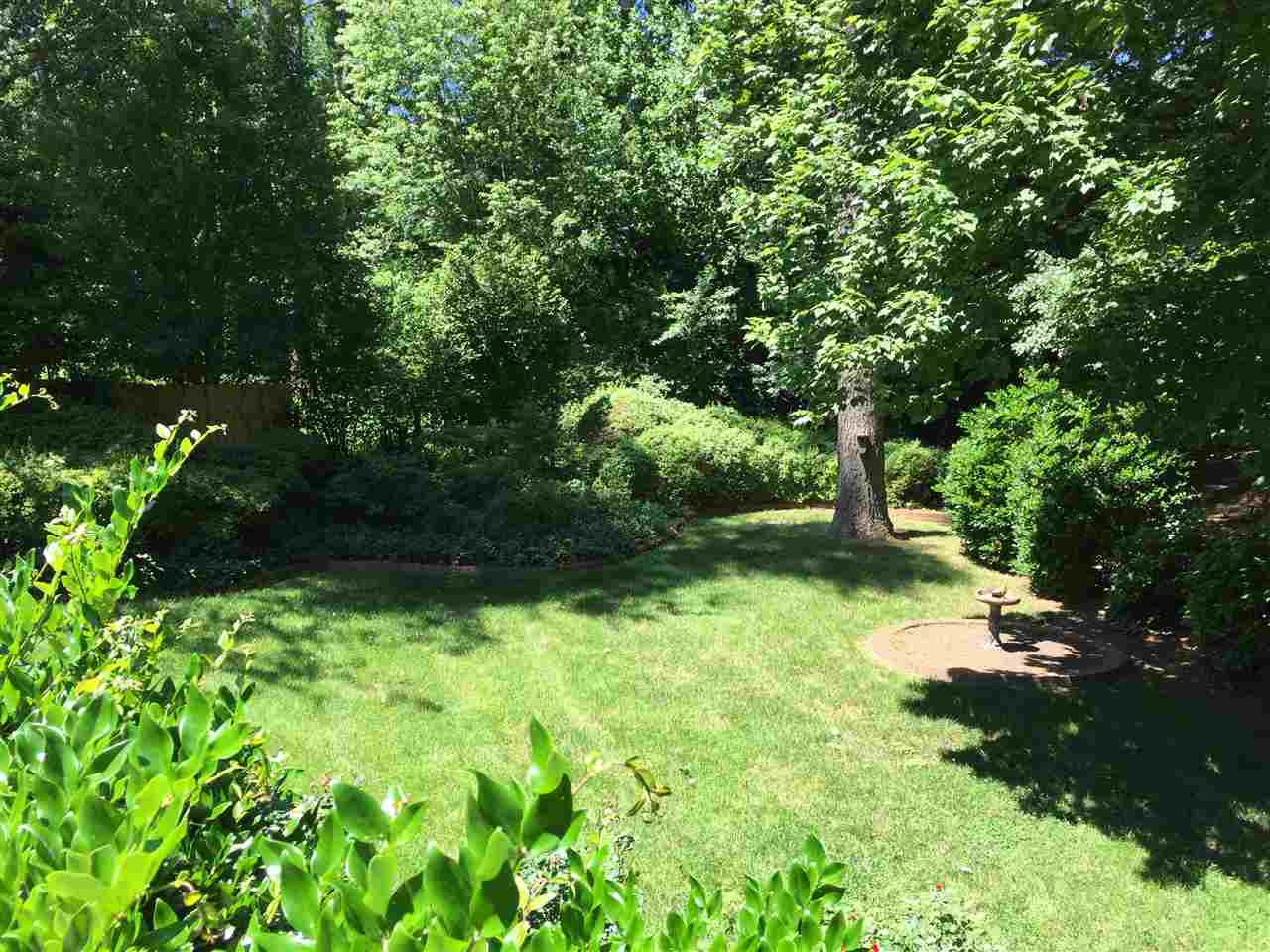 5721 Deblyn Avenue Raleigh, NC 27612 - Photo 11 of 12 Peaceful, lush, and green, the backyard has a park like setting. Come see what relaxed living can be like.... Yard