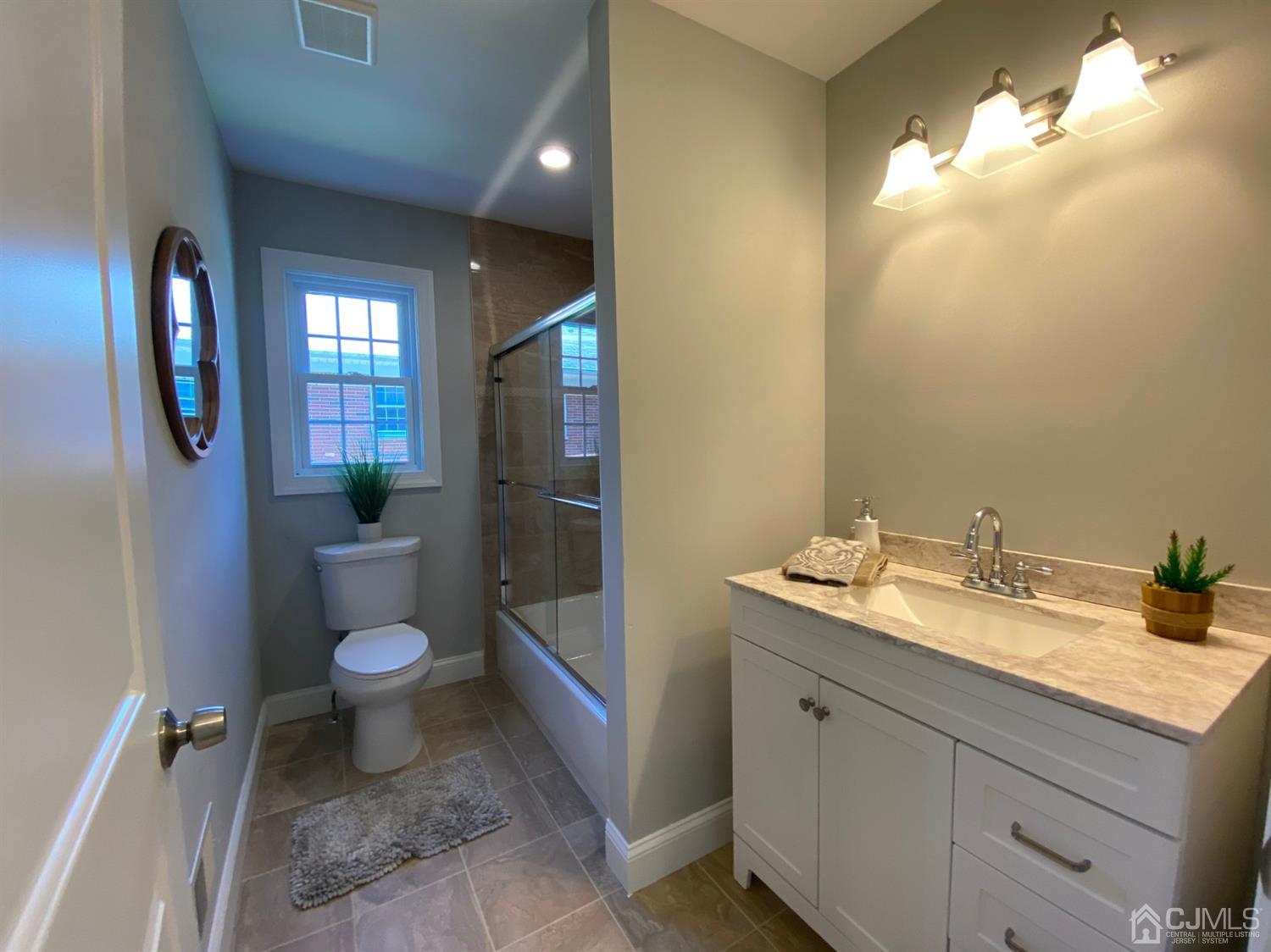 99 Jordan Road Colonia, NJ 07067 - Photo 16 of 53 a bathroom with a granite countertop sink toilet and shower