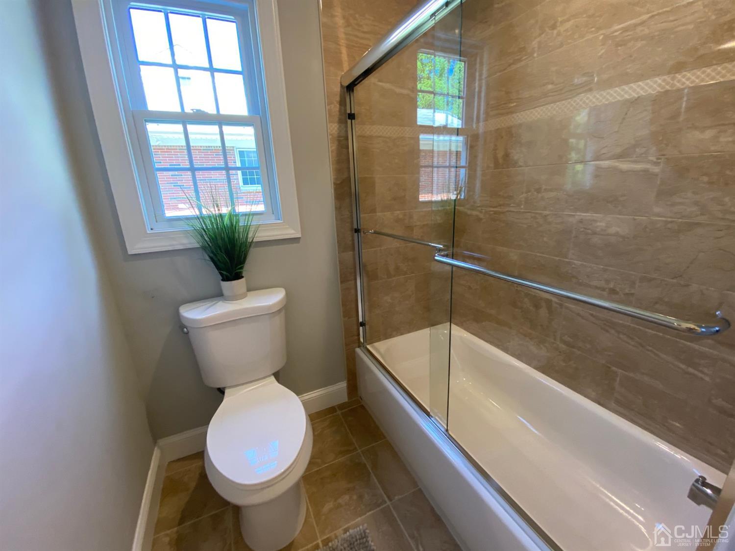 99 Jordan Road Colonia, NJ 07067 - Photo 17 of 53 a bathroom with a toilet and a bathtub