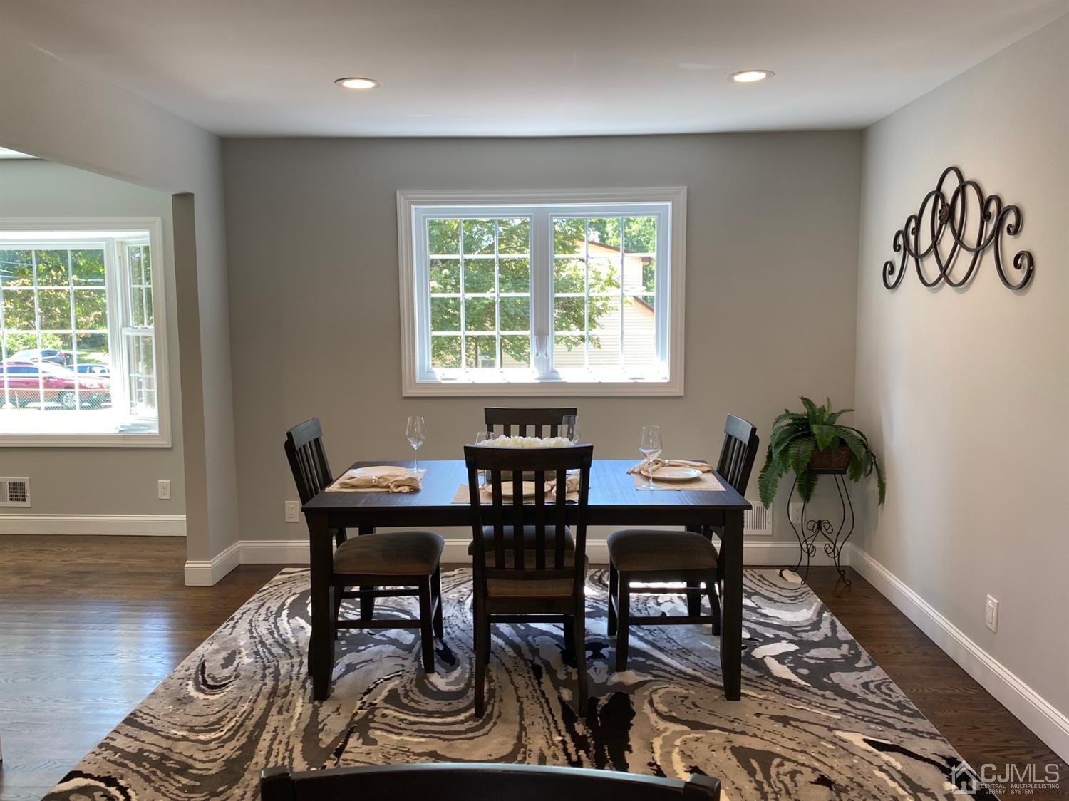99 Jordan Road Colonia, NJ 07067 - Photo 18 of 53 a view of a dining room with furniture window and wooden floor