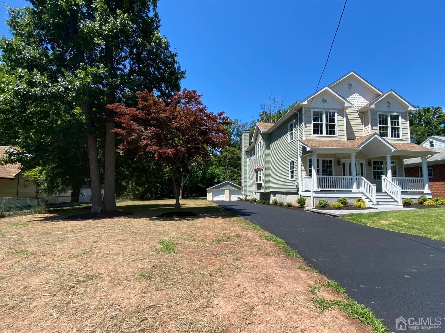 99 Jordan Road Colonia, NJ 07067 - Photo 3 of 53 a front view of a house with a yard