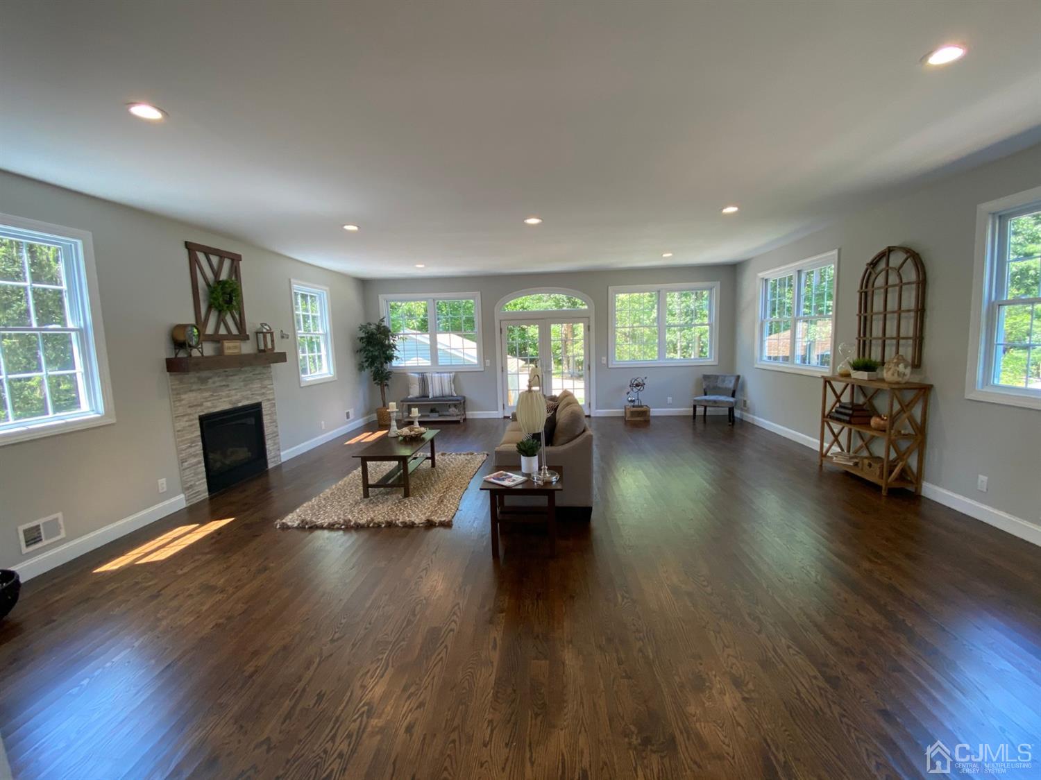 99 Jordan Road Colonia, NJ 07067 - Photo 24 of 53 a living room with fireplace furniture and a wooden floor