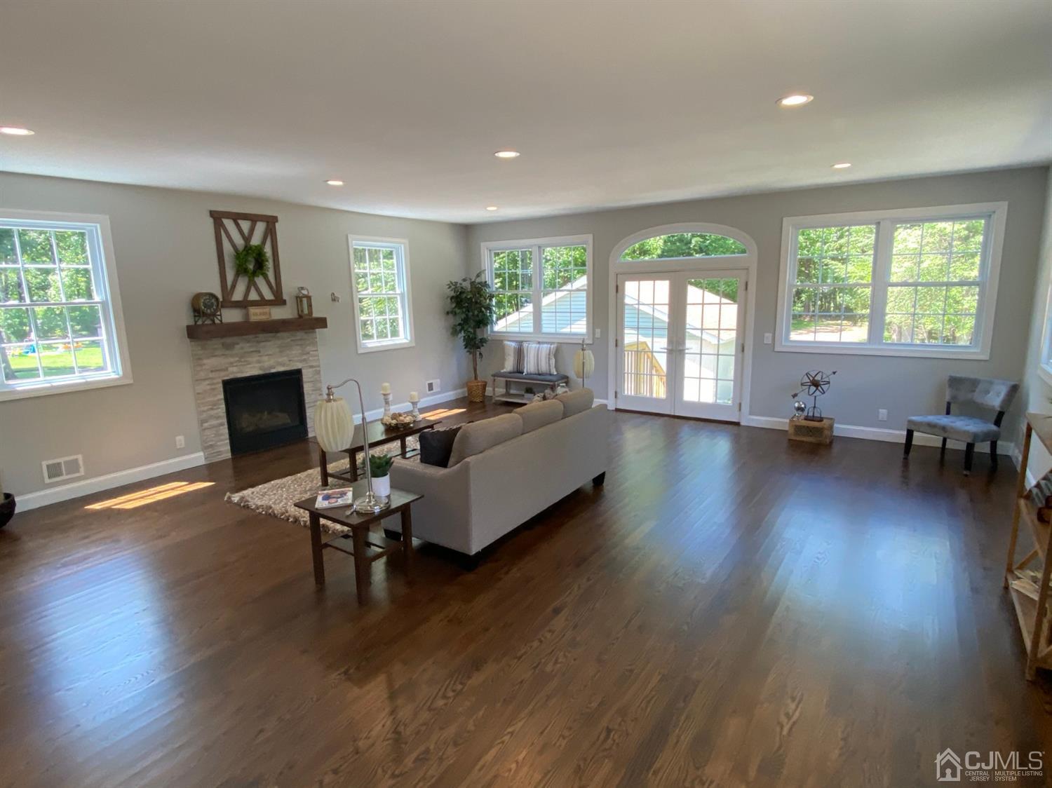 99 Jordan Road Colonia, NJ 07067 - Photo 25 of 53 a living room with furniture and a fireplace