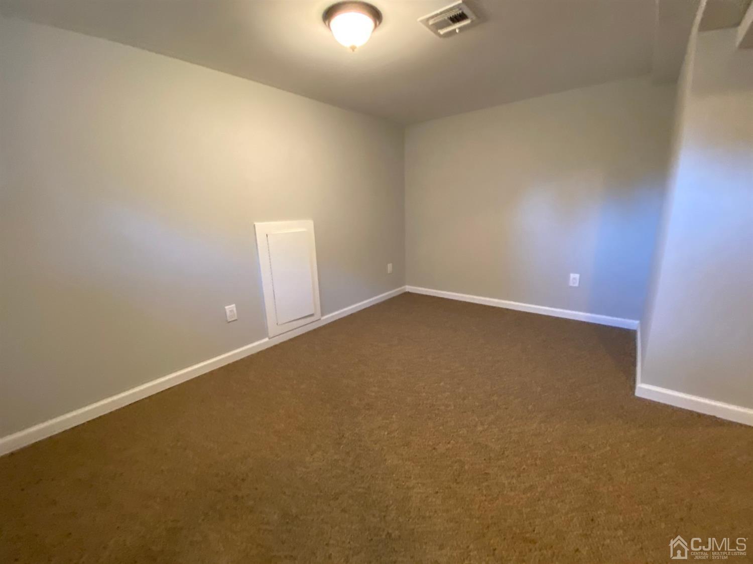 99 Jordan Road Colonia, NJ 07067 - Photo 32 of 53 an empty room with a empty space and a window