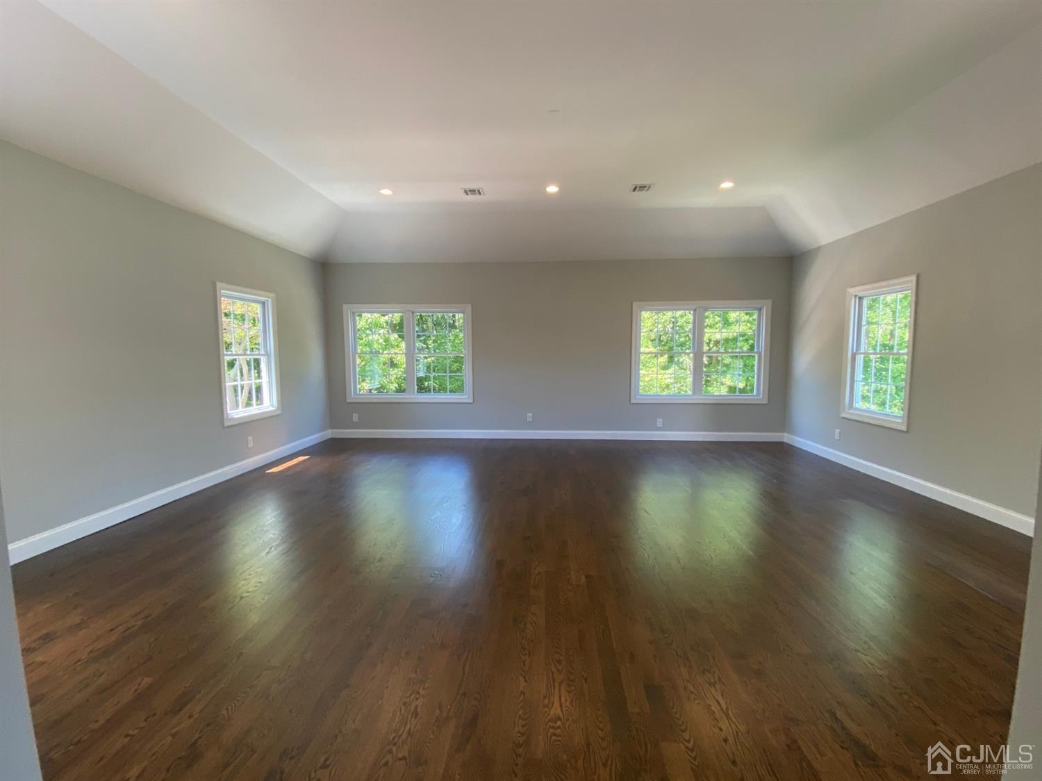 99 Jordan Road Colonia, NJ 07067 - Photo 38 of 53 a view of an empty room with wooden floor and a window