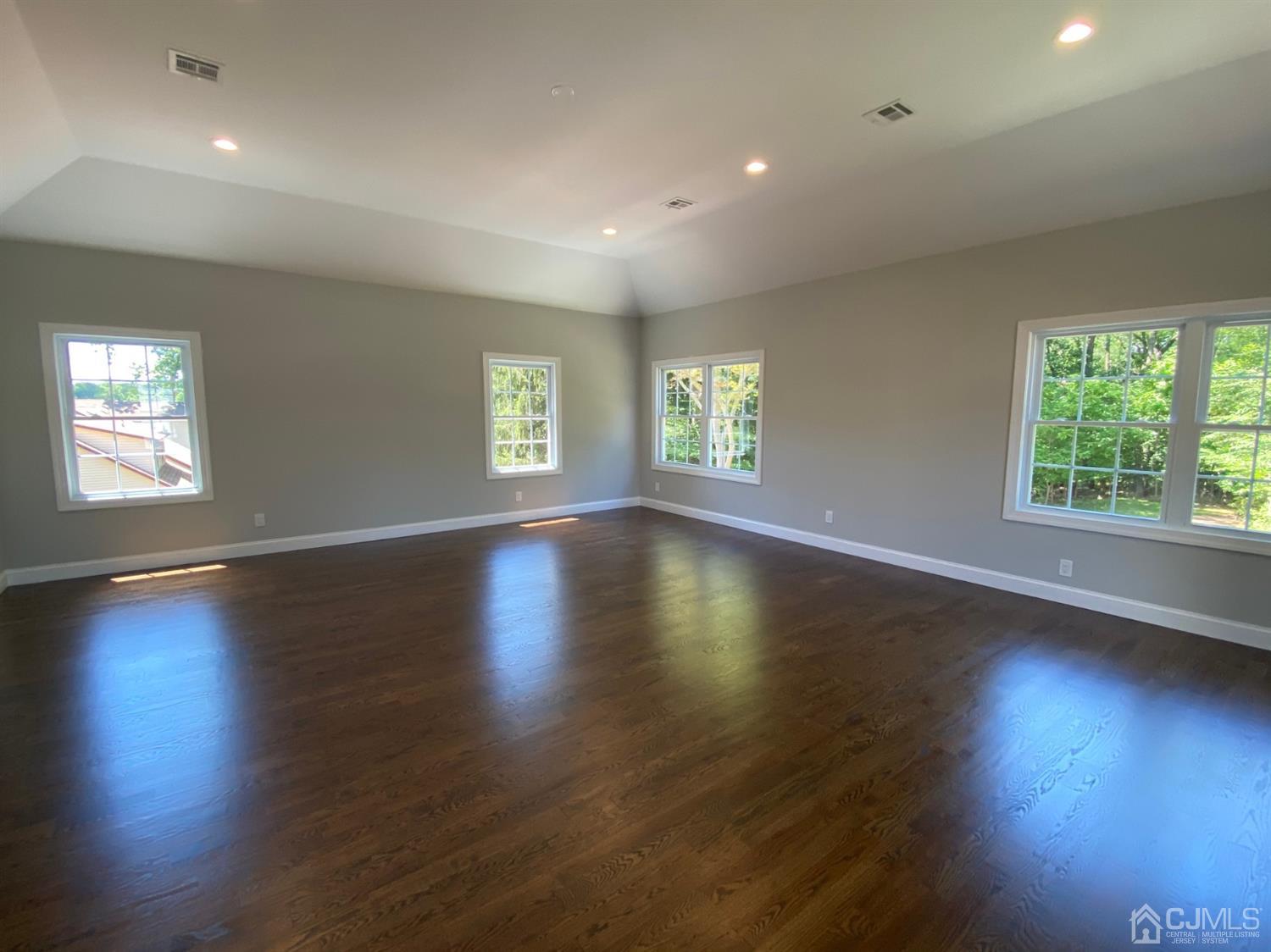 99 Jordan Road Colonia, NJ 07067 - Photo 39 of 53 an empty room with wooden floor and windows
