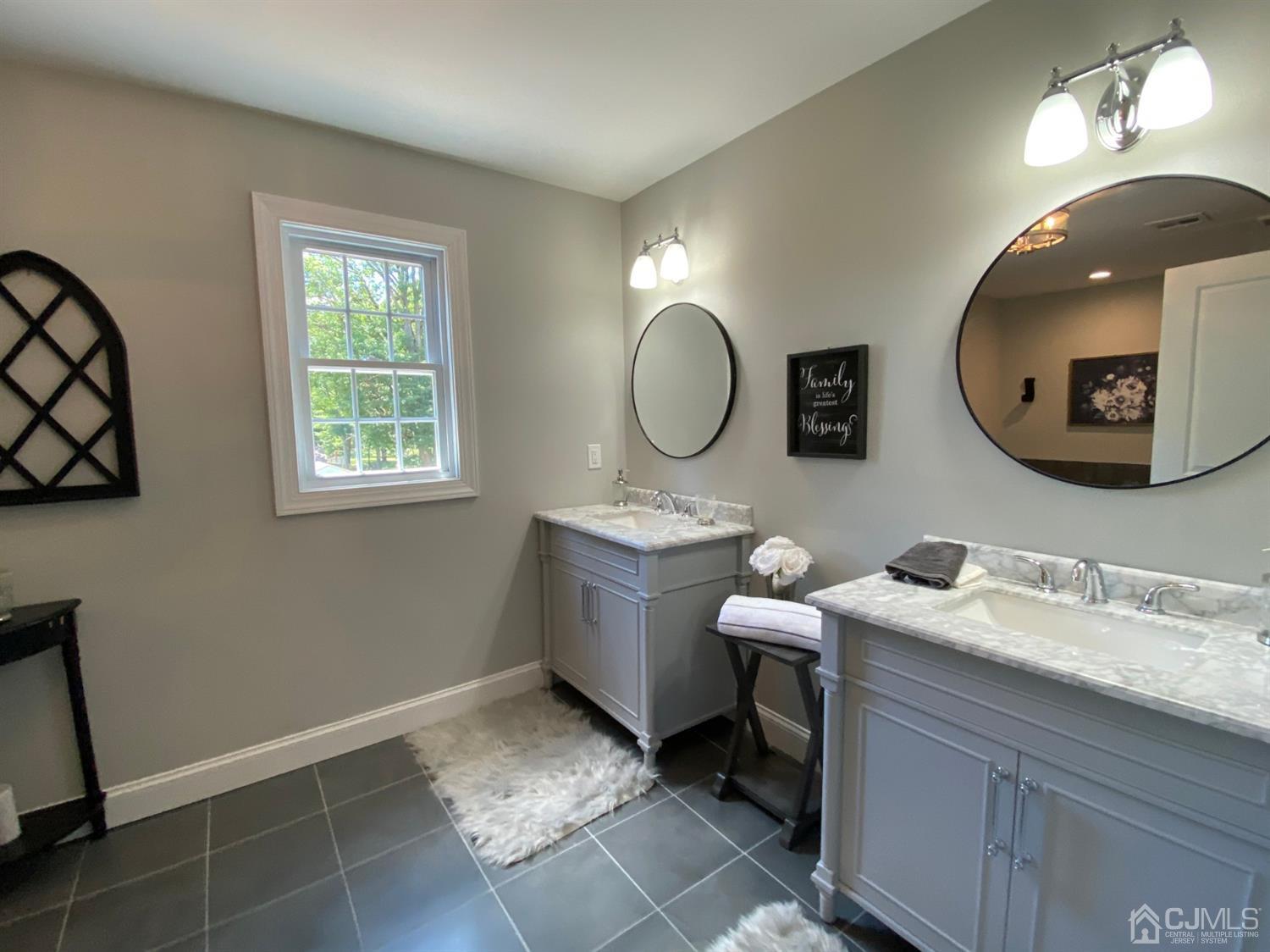 99 Jordan Road Colonia, NJ 07067 - Photo 41 of 53 a bathroom with a granite countertop sink mirror and vanity