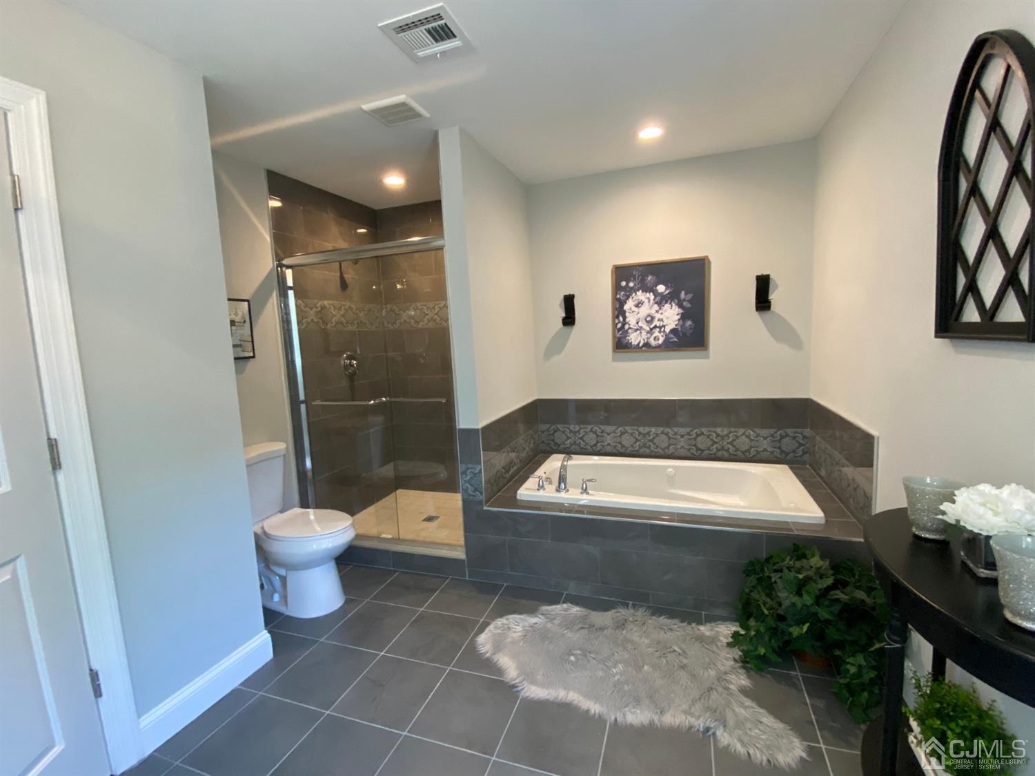 99 Jordan Road Colonia, NJ 07067 - Photo 42 of 53 a bathroom with a toilet a sink and a shower