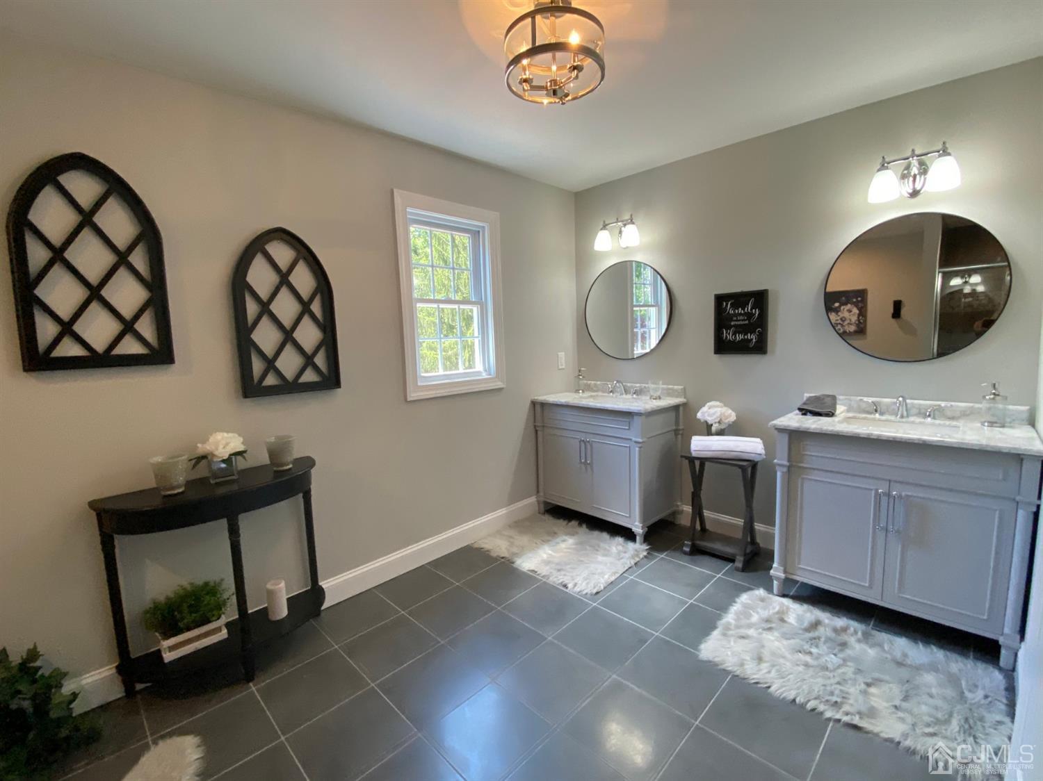 99 Jordan Road Colonia, NJ 07067 - Photo 43 of 53 a bathroom with a toilet a sink and mirror