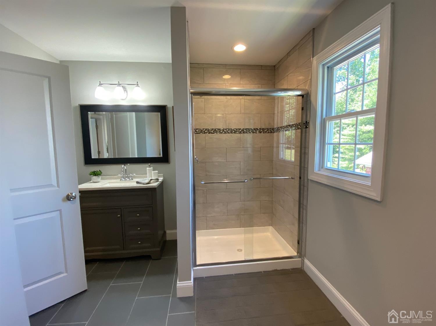 99 Jordan Road Colonia, NJ 07067 - Photo 47 of 53 a bathroom with a sink a toilet and shower