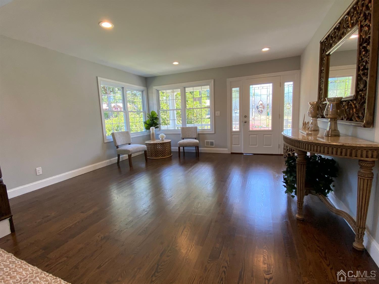 99 Jordan Road Colonia, NJ 07067 - Photo 6 of 53 a living room with furniture and a fireplace