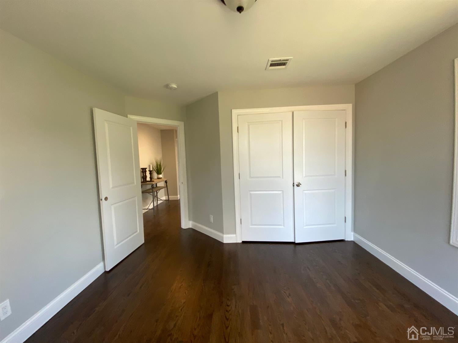 99 Jordan Road Colonia, NJ 07067 - Photo 52 of 53 wooden floor in an empty room