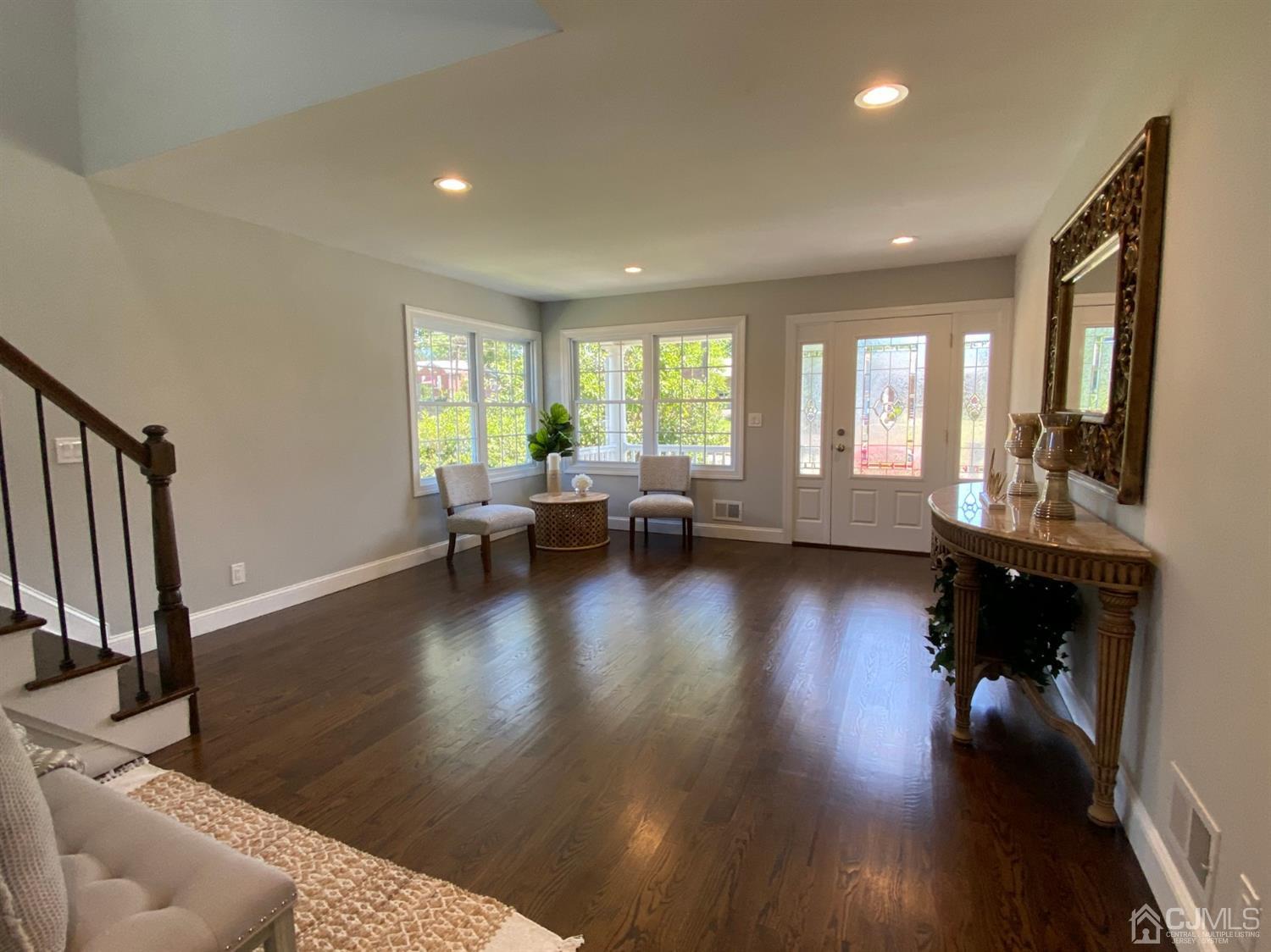 99 Jordan Road Colonia, NJ 07067 - Photo 8 of 53 a living room with fireplace furniture and a wooden floor