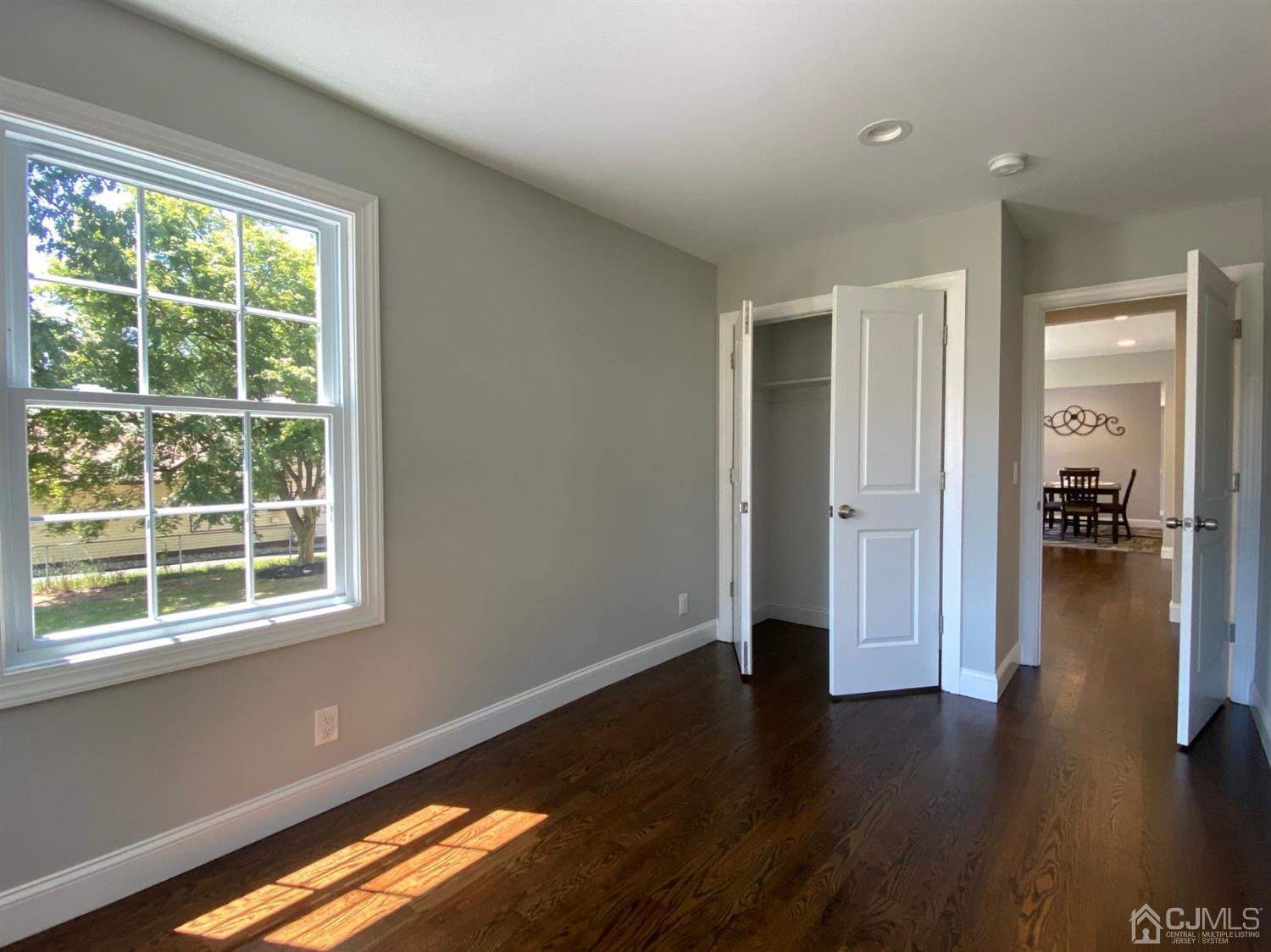 99 Jordan Road Colonia, NJ 07067 - Photo 10 of 53 a view of a hallway with hardwood floor and a window