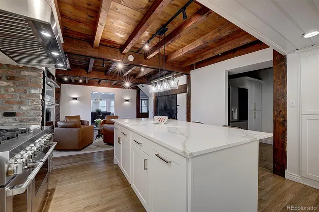 a stove top oven sitting inside of a kitchen