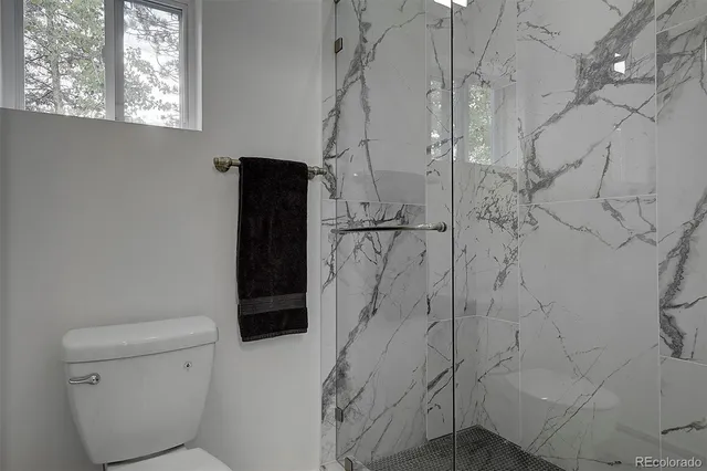 a living room with lots of furniture and a book shelf