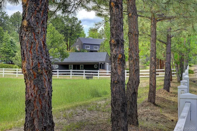 a view of a house with a trees