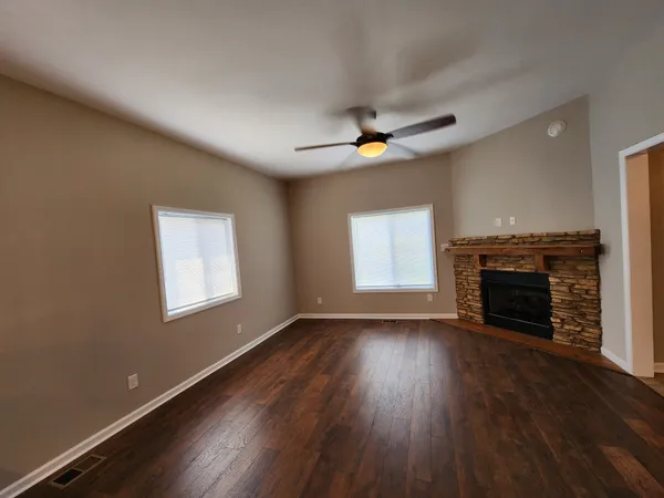 a view of a workspace with furniture and a kitchen
