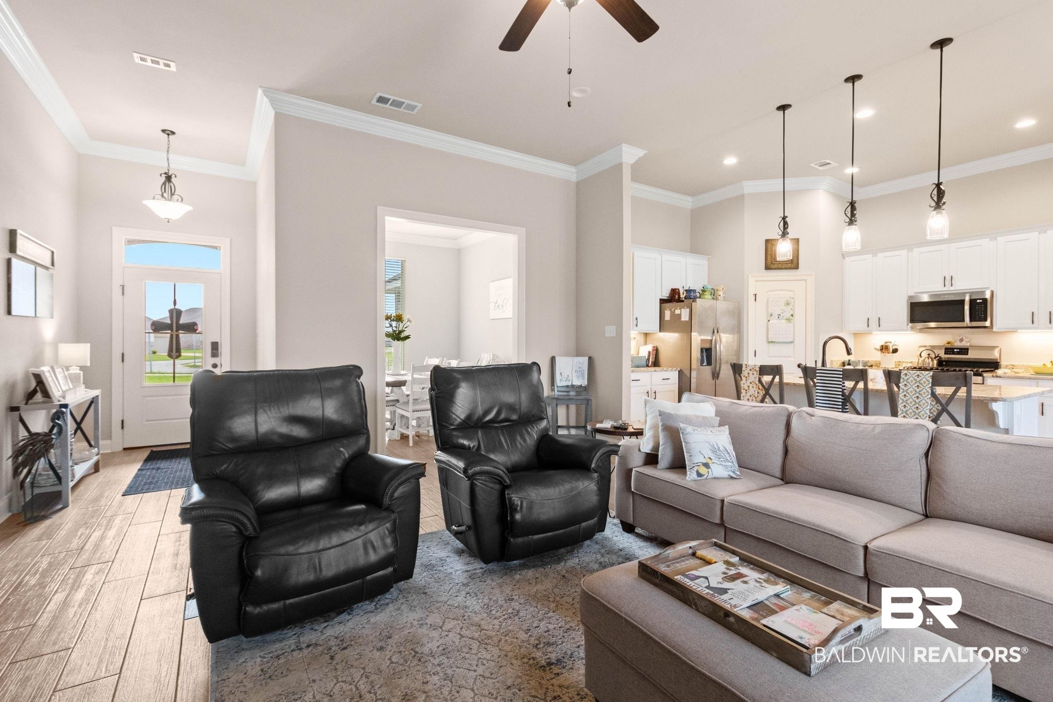 22244 Hibiscus Circle Foley, AL 36535 - Photo 17 of 51 Open-concept living area featuring wood-finish flooring, a contemporary ceiling fan, and recessed lighting