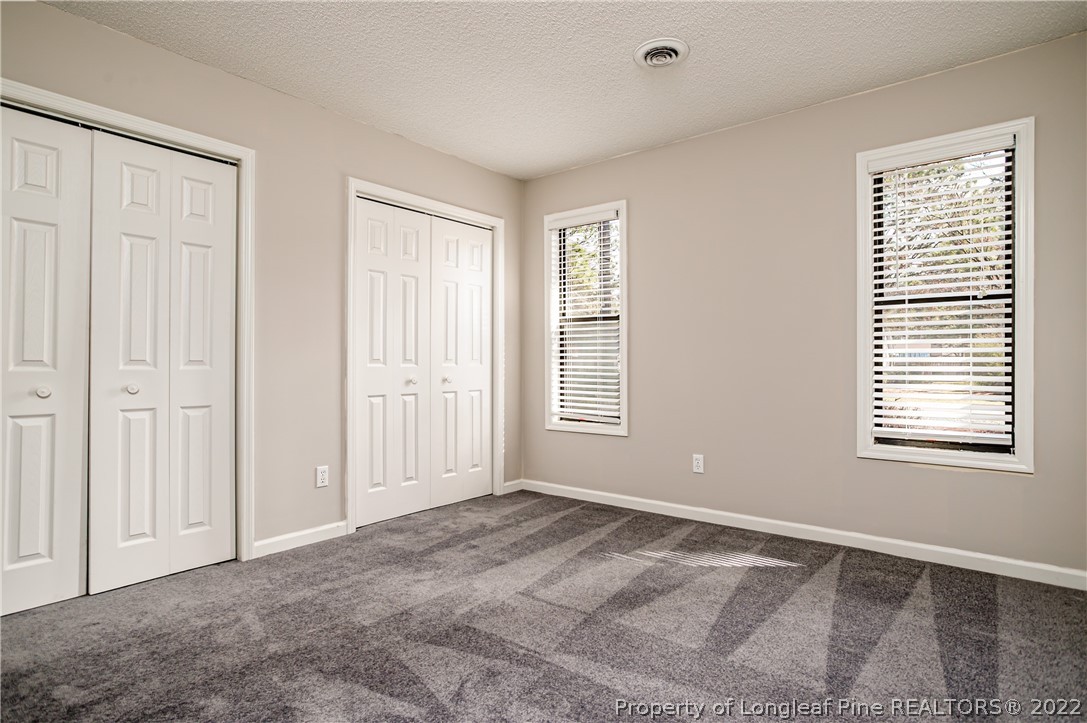 215 Fox Run Road Pinehurst, NC 28374 - Photo 15 of 24 a view of an empty room with a window