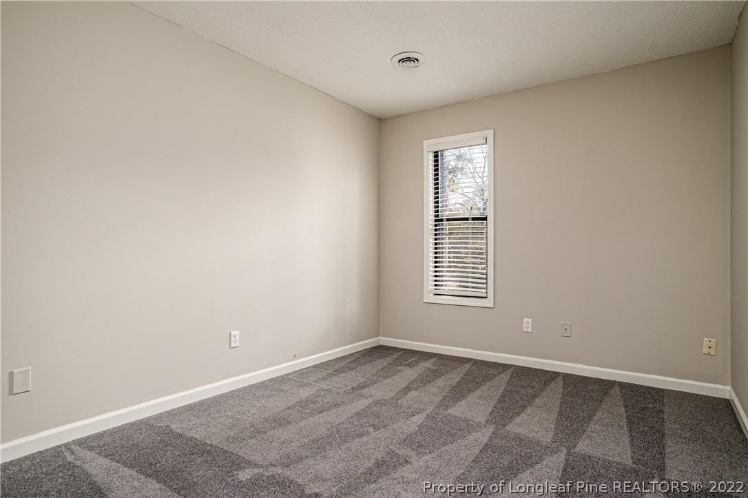 215 Fox Run Road Pinehurst, NC 28374 - Photo 18 of 24 an empty room with a window