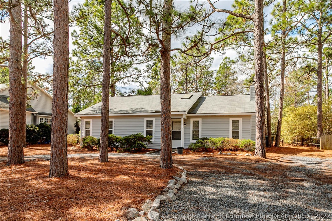 215 Fox Run Road Pinehurst, NC 28374 - Photo 2 of 24 a front view of a house with a tree s