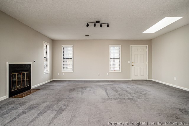 215 Fox Run Road Pinehurst, NC 28374 - Photo 4 of 24 an empty room with windows