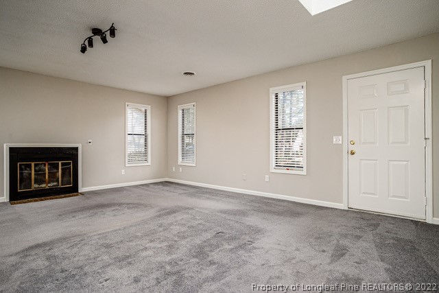 215 Fox Run Road Pinehurst, NC 28374 - Photo 6 of 24 a view of an empty room with a window
