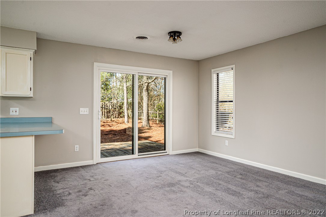 215 Fox Run Road Pinehurst, NC 28374 - Photo 7 of 24 an empty room with windows