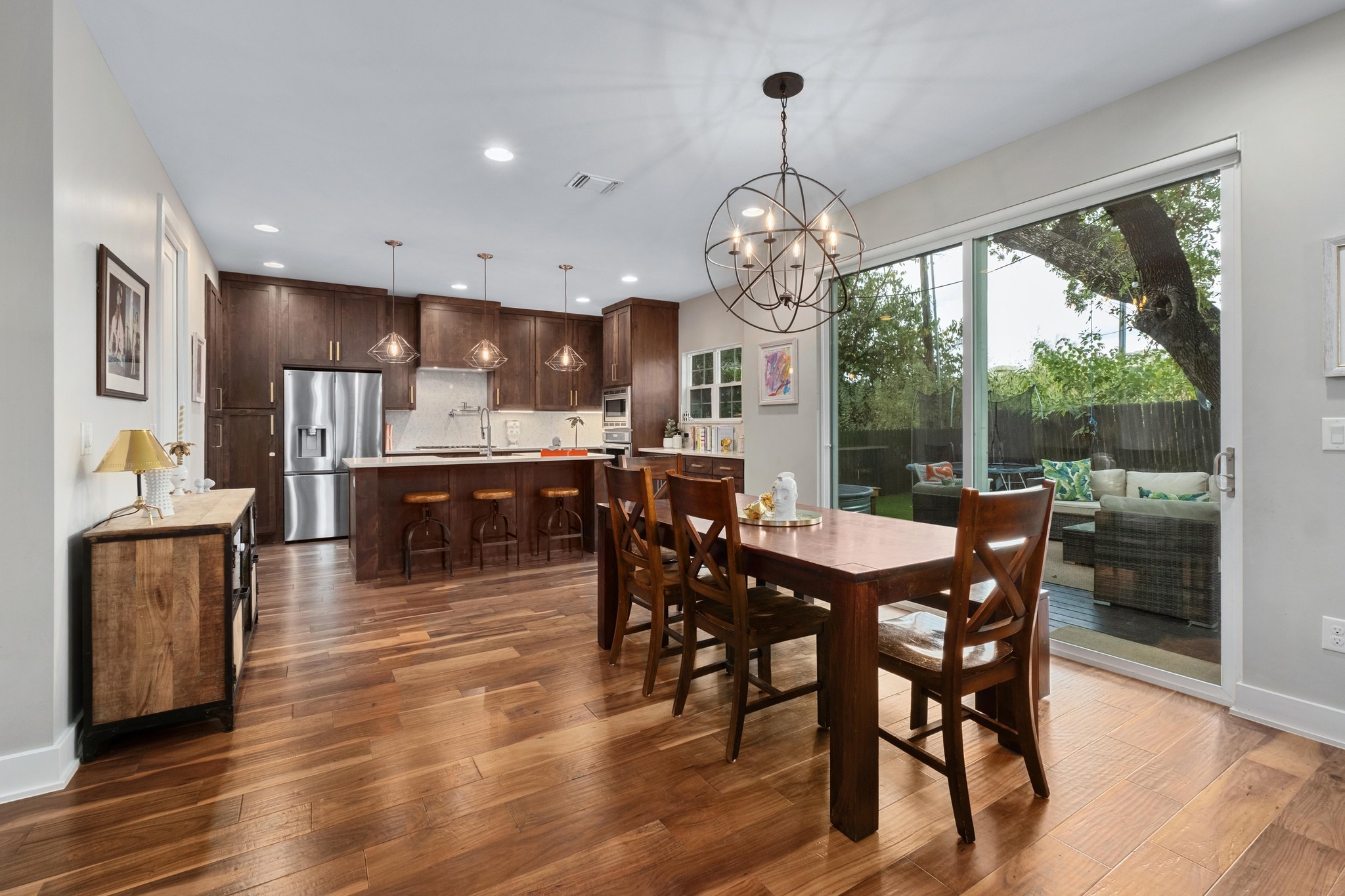 3302 Funston Street Austin, TX 78703 - Photo 12 of 36 Dining room with recessed lighting, dark wood-style floors, and a chandelier