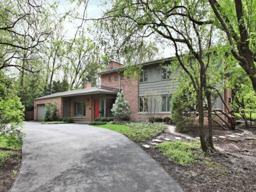 1010 Mt Pleasant Road Winnetka, IL 60093 - Photo 1 of 1 a front view of a house with yard and trees
