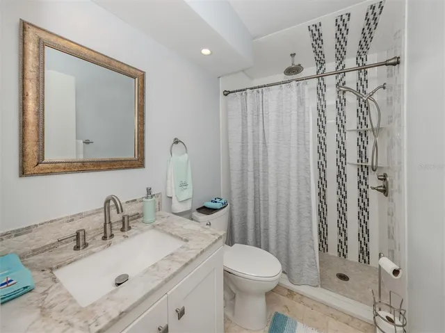 an aerial view of a house with garden space and street view