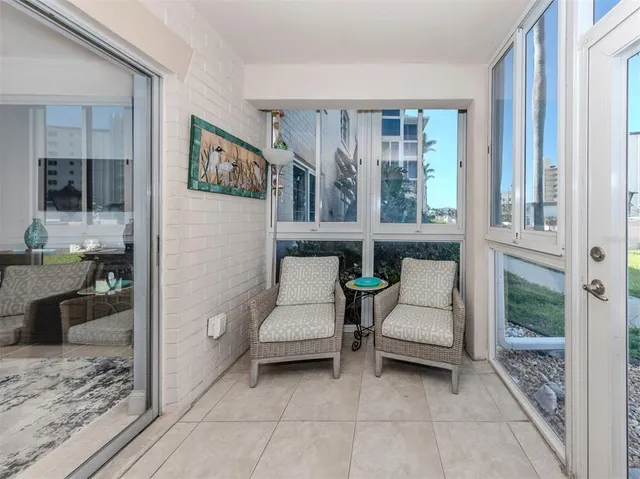 a living room with furniture window and wooden floor