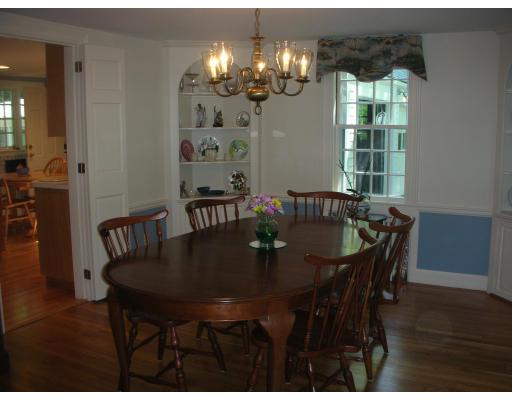 33 Hoover Road Needham, MA 02494 - Photo 3 of 6 a view of a dining room with furniture and chandelier