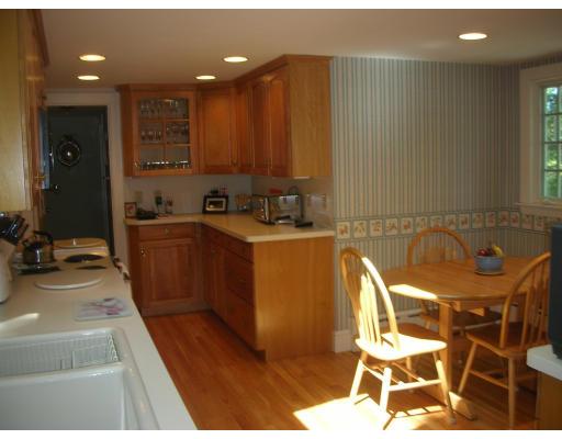 33 Hoover Road Needham, MA 02494 - Photo 4 of 6 a view of a kitchen with a sink and furniture