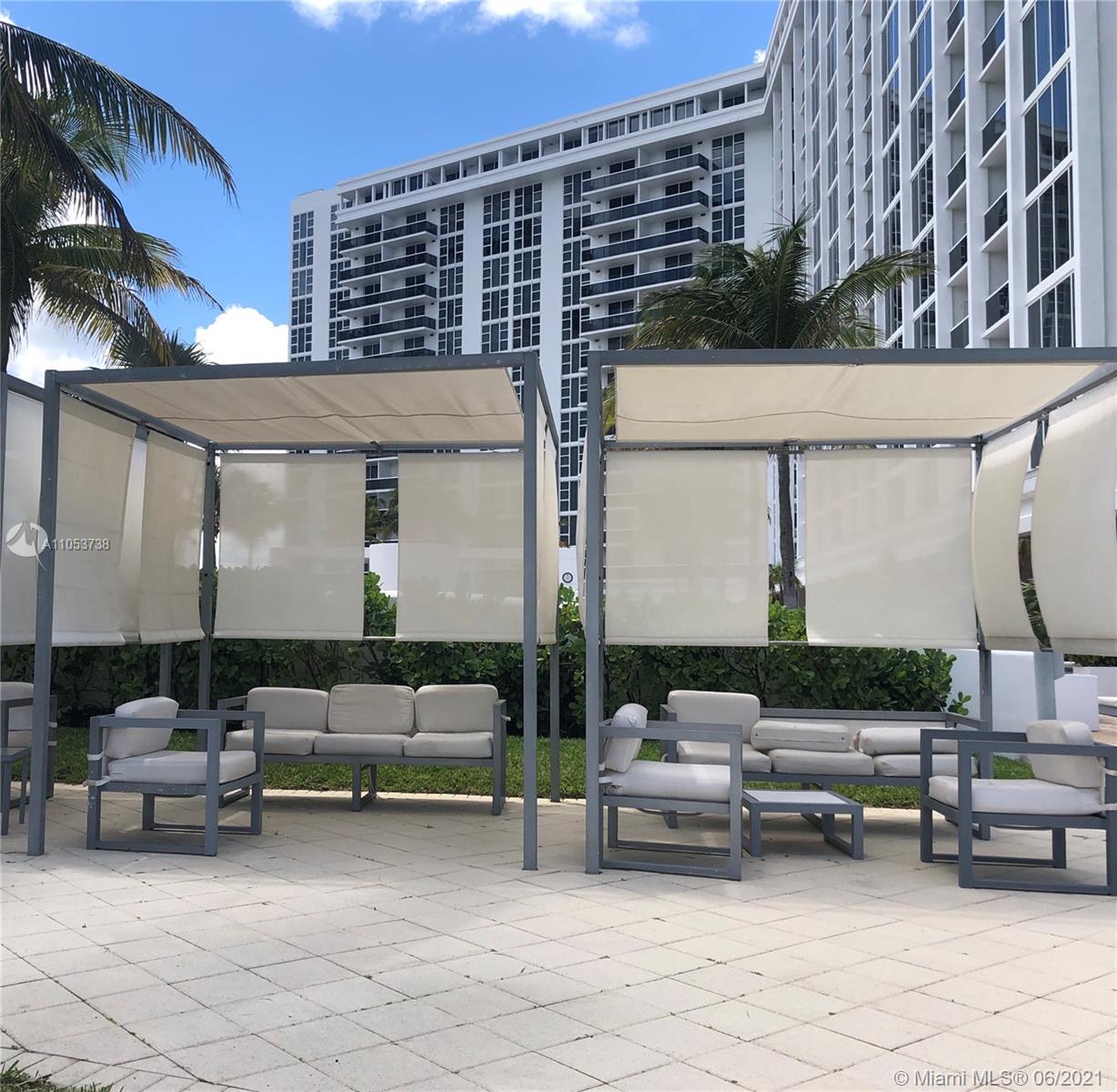 10275 Collins Avenue, Unit 425 Bal Harbour, FL 33154 - Photo 17 of 18 a car parked in front of a building