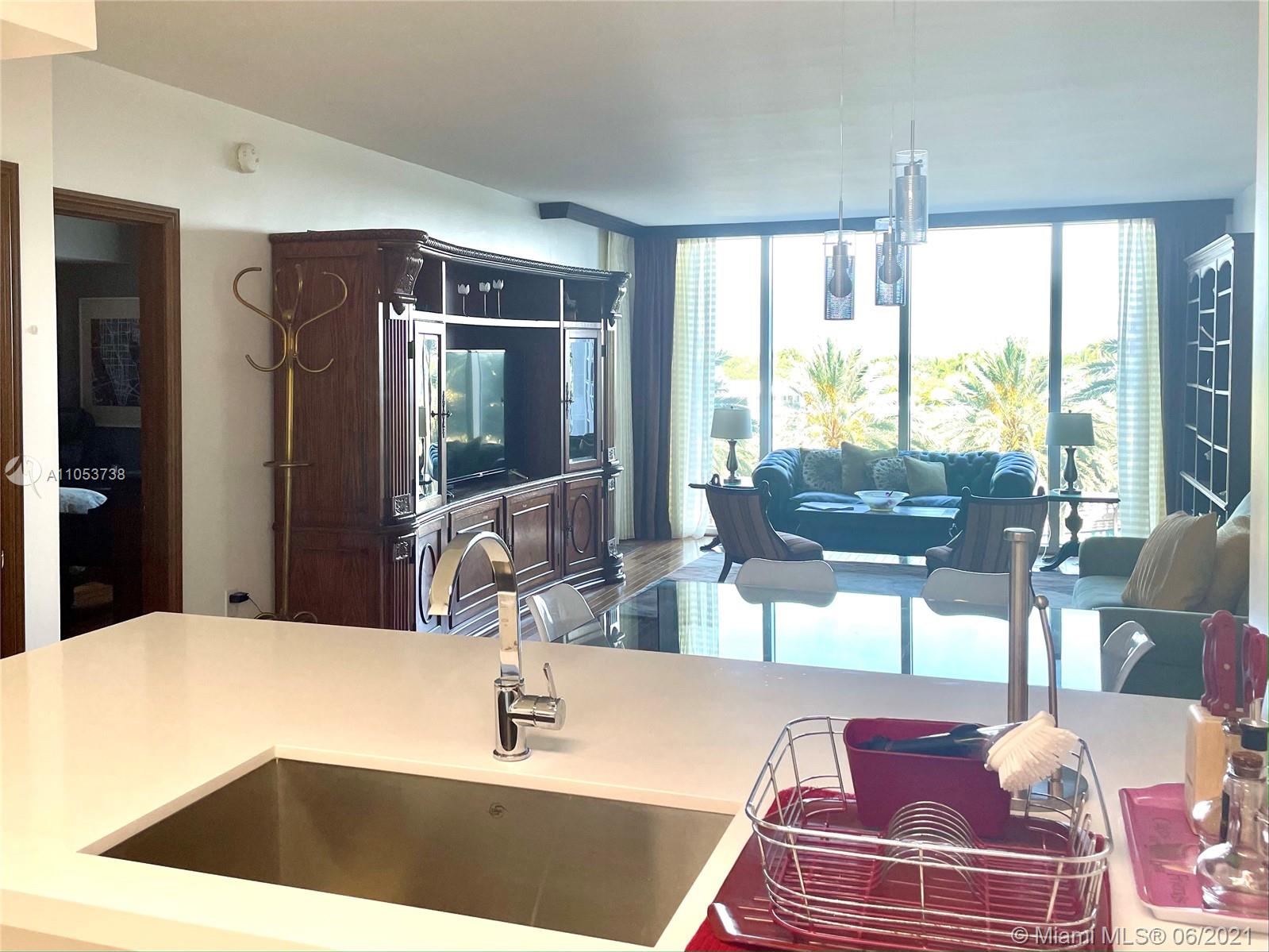 10275 Collins Avenue, Unit 425 Bal Harbour, FL 33154 - Photo 5 of 18 a kitchen with a sink and a large window