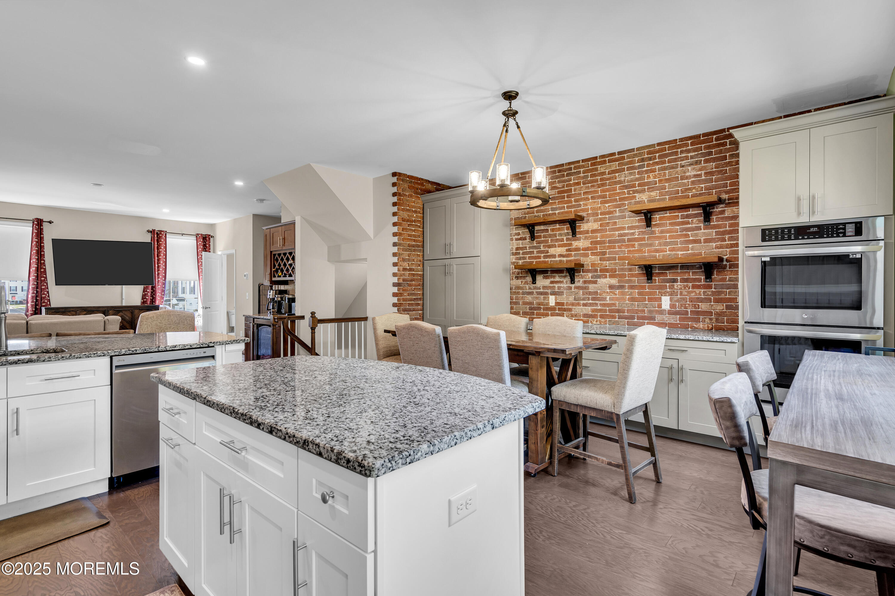 305 Spirit Way, Unit 505 Brick, NJ 08723 - Photo 13 of 28 a kitchen with sink cabinets and dining table