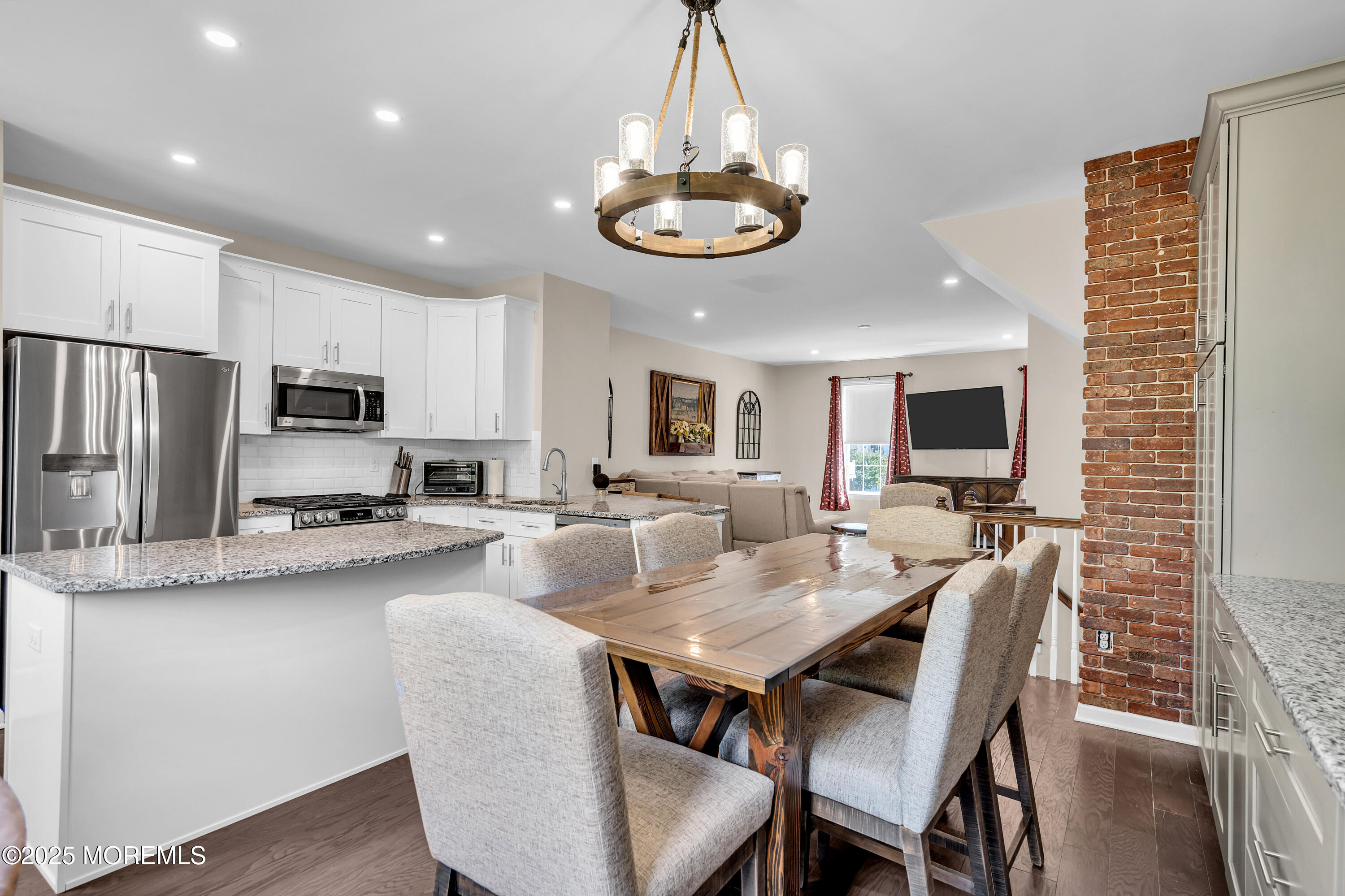 305 Spirit Way, Unit 505 Brick, NJ 08723 - Photo 17 of 28 a view of kitchen with sink dining table and chairs