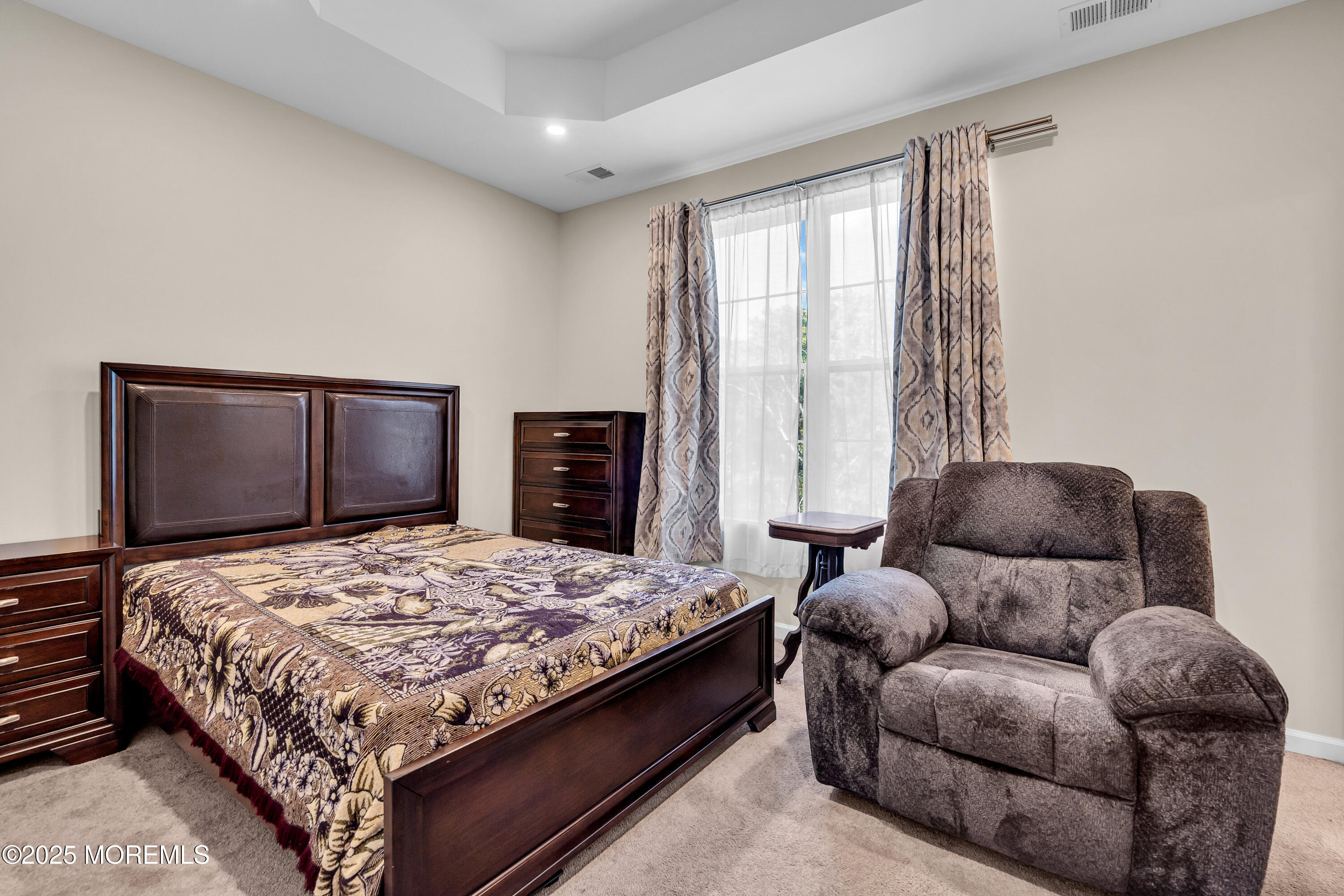 305 Spirit Way, Unit 505 Brick, NJ 08723 - Photo 19 of 28 a bedroom with a bed and couch