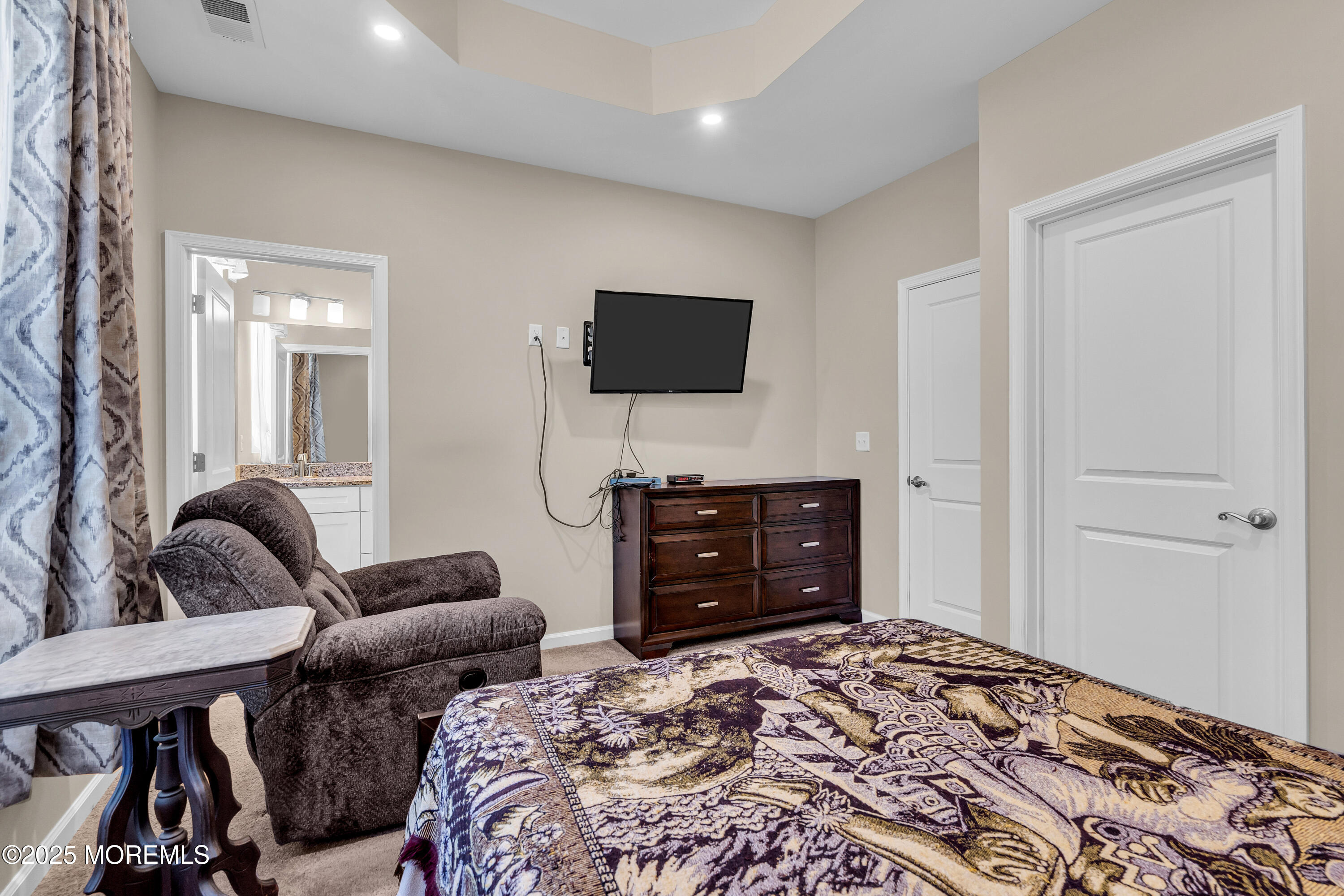 305 Spirit Way, Unit 505 Brick, NJ 08723 - Photo 20 of 28 a bedroom with a bed and a television