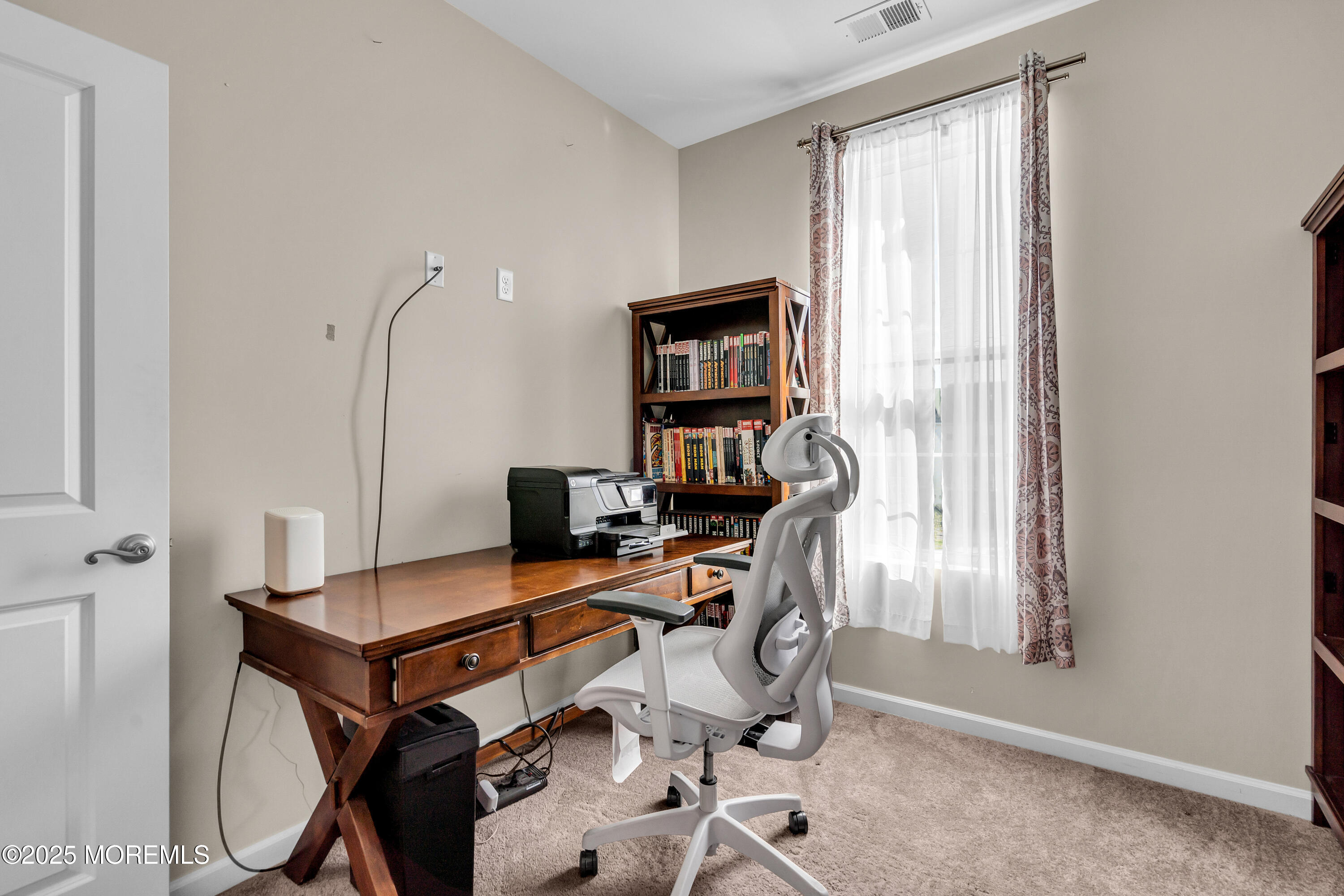 305 Spirit Way, Unit 505 Brick, NJ 08723 - Photo 24 of 28 a view of a workspace with furniture and a window