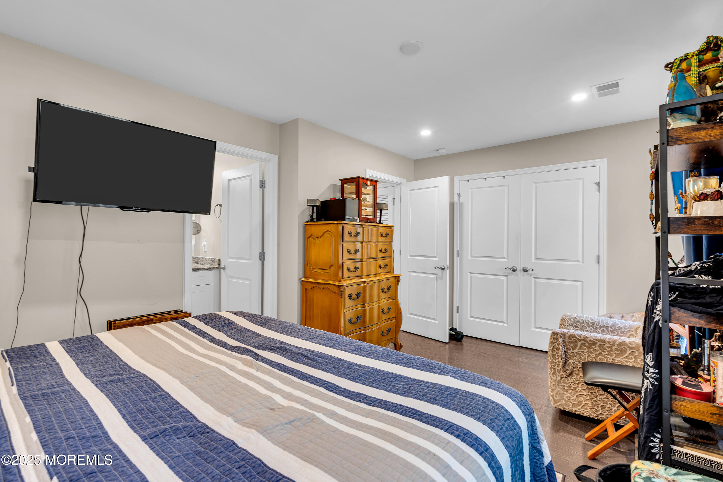 305 Spirit Way, Unit 505 Brick, NJ 08723 - Photo 5 of 28 a bedroom with a bed and a flat screen tv